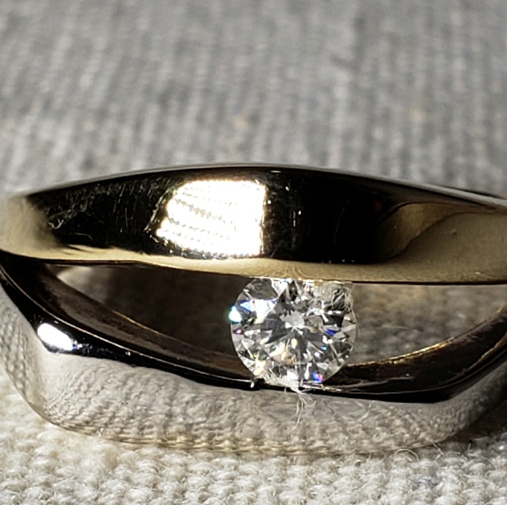 14kt tension set solitaire diamond ring.